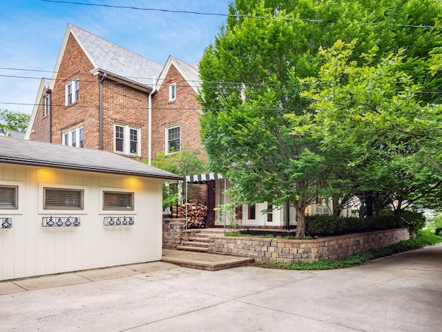 1635 Cambridge Blvd, Upper Arlington, OH 43212 - view of property exterior with brick siding and a high end roof