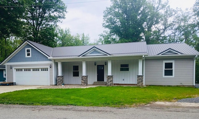 15848 Barnes Dr, Belle Center, OH 43310 - craftsman-style home featuring a porch, an attached garage, board and batten siding, a front lawn, and driveway