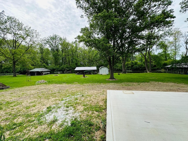15848 Barnes Dr, Belle Center, OH 43310 - view of green lawn featuring a carport
