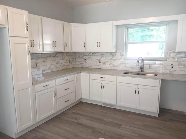 15848 Barnes Dr, Belle Center, OH 43310 - kitchen with white cabinetry, tasteful backsplash, and light countertops