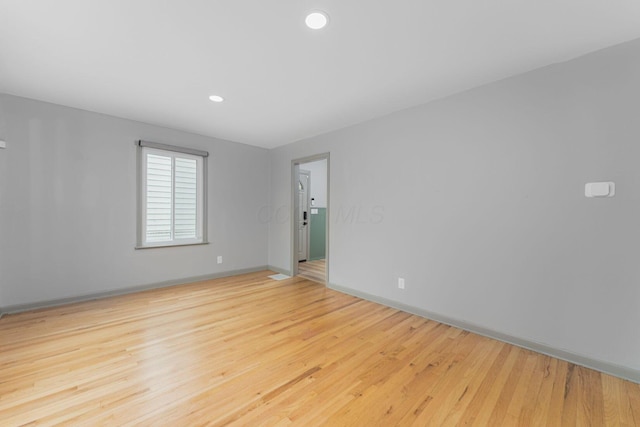 831 E Longview Ave, Columbus, OH 43224 - spare room featuring baseboards, wood finished floors, and recessed lighting