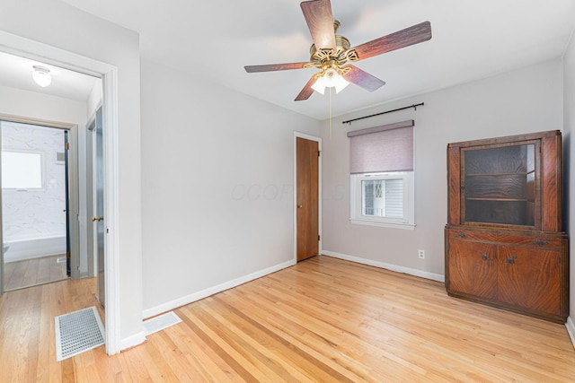 831 E Longview Ave, Columbus, OH 43224 - unfurnished bedroom featuring light wood-style floors, baseboards, and ceiling fan