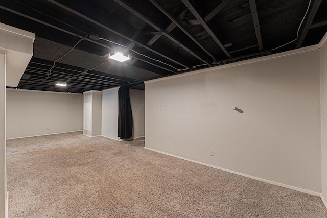 831 E Longview Ave, Columbus, OH 43224 - finished below grade area featuring carpet floors and baseboards