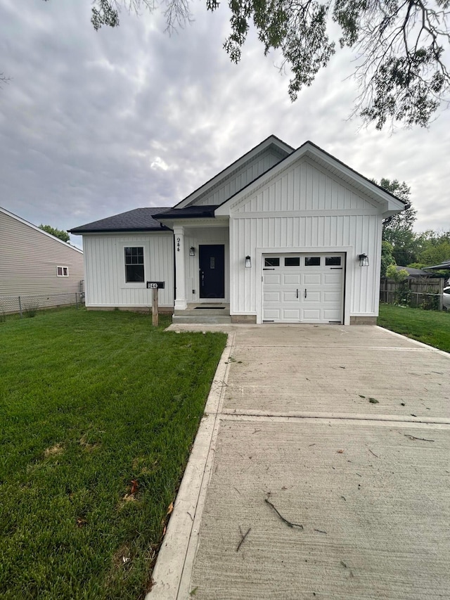 944 Binns Blvd, Columbus, OH 43204 - modern farmhouse style home with board and batten siding, driveway, and an attached garage