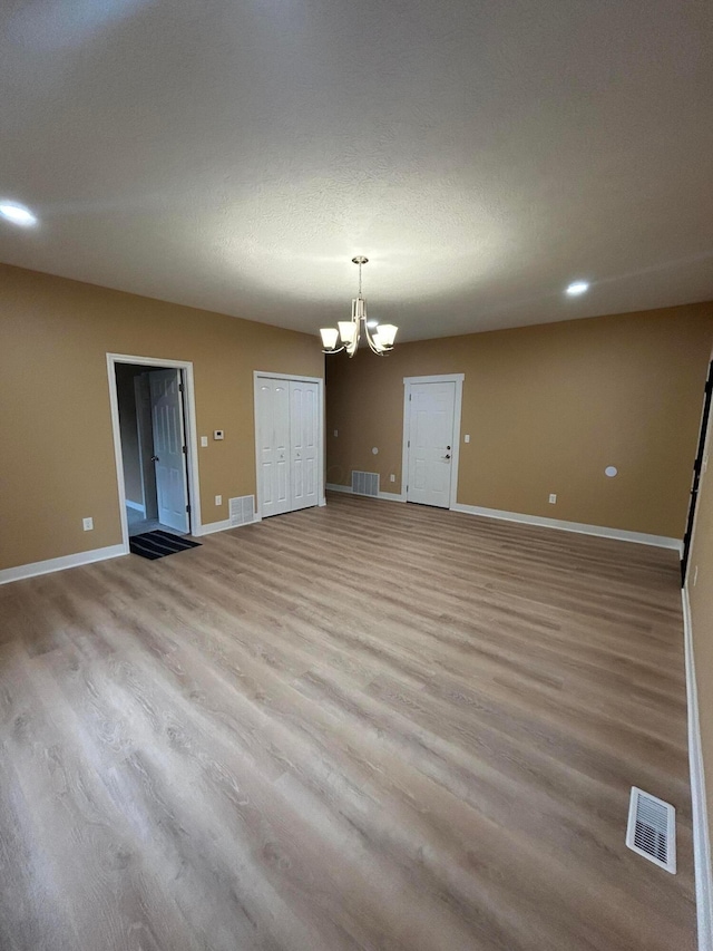 944 Binns Blvd, Columbus, OH 43204 - unfurnished room featuring a chandelier, light wood-type flooring, and baseboards