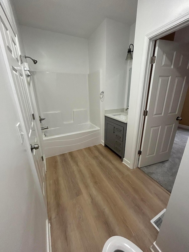 944 Binns Blvd, Columbus, OH 43204 - full bathroom with bathing tub / shower combination, vanity, and wood finished floors