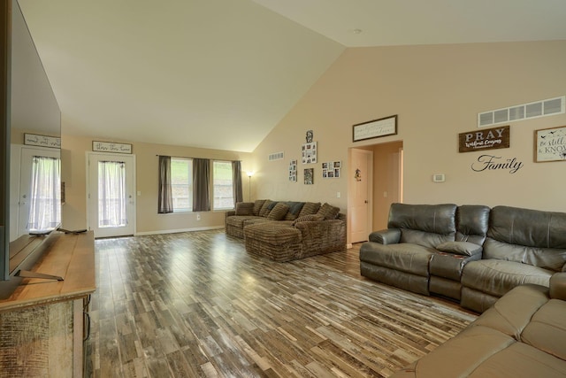 9805 Beaver Pike, Jackson, OH 45640 - living room with high vaulted ceiling, wood finished floors, and baseboards