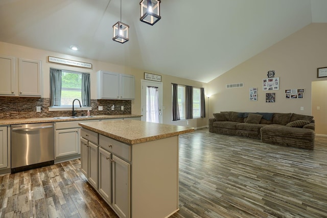 9805 Beaver Pike, Jackson, OH 45640 - kitchen featuring stainless steel dishwasher, a sink, lofted ceiling, open floor plan, and dark wood-type flooring