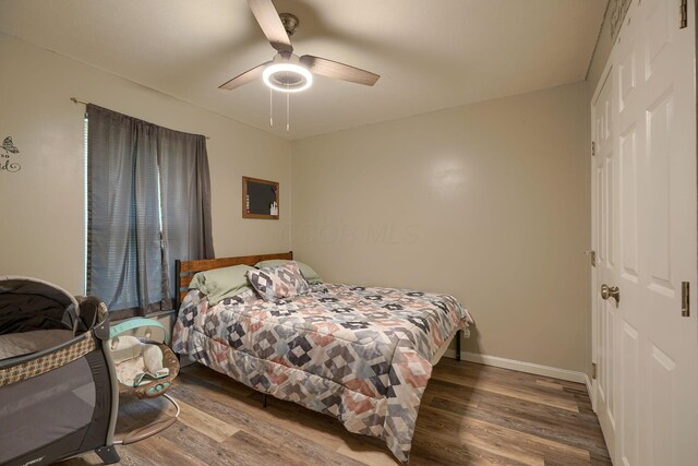 9805 Beaver Pike, Jackson, OH 45640 - bedroom featuring wood finished floors, baseboards, ceiling fan, and a closet