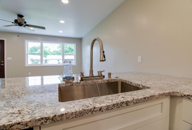 1541 Taft St, Marion, OH 43302 - kitchen with a sink, recessed lighting, light stone counters, ceiling fan, and white cabinetry