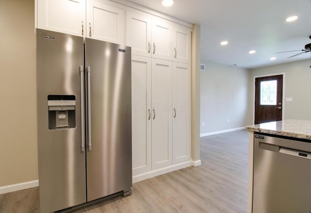 1541 Taft St, Marion, OH 43302 - kitchen featuring appliances with stainless steel finishes, ceiling fan, light stone countertops, light wood-style flooring, and baseboards