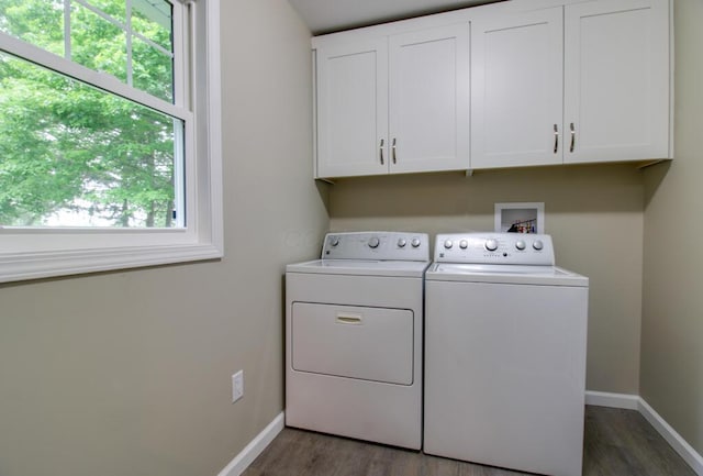 1541 Taft St, Marion, OH 43302 - laundry room featuring cabinet space, washing machine and clothes dryer, baseboards, and wood finished floors