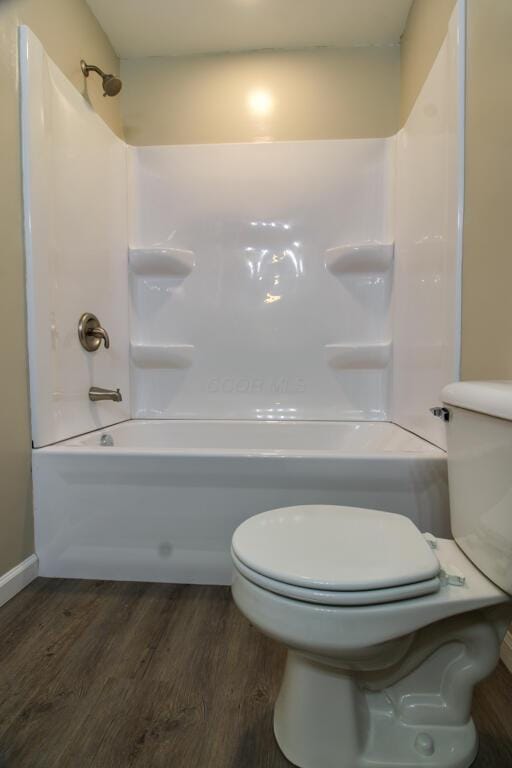 1541 Taft St, Marion, OH 43302 - full bathroom with toilet, wood finished floors, and shower / bathtub combination