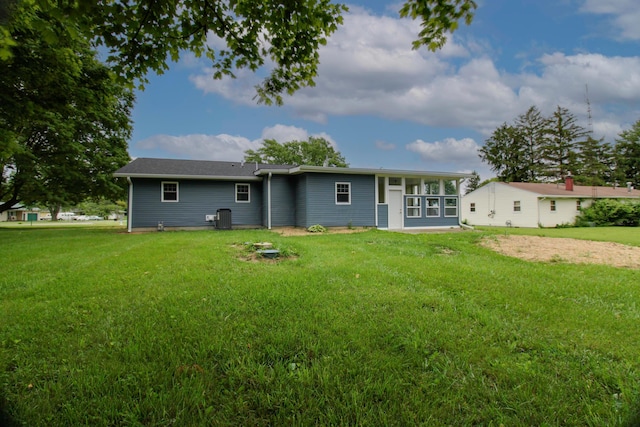 1541 Taft St, Marion, OH 43302 - back of house with a lawn and central air condition unit