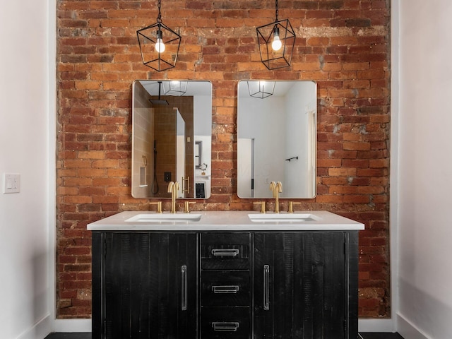 883 Wilson Ave, Columbus, OH 43206 - full bath featuring brick wall, double vanity, and baseboards