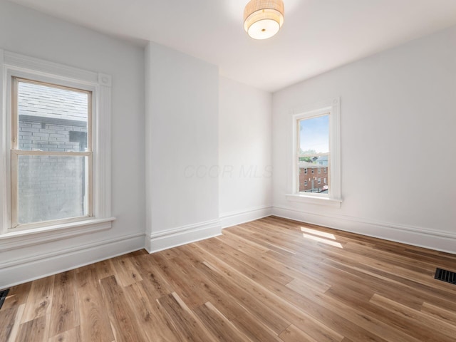 883 Wilson Ave, Columbus, OH 43206 - empty room with light wood finished floors and baseboards