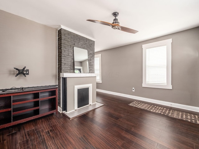 533 Stewart Ave, Columbus, OH 43206 - unfurnished living room featuring a ceiling fan, plenty of natural light, dark wood-style flooring, and baseboards