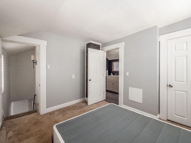 533 Stewart Ave, Columbus, OH 43206 - unfurnished bedroom featuring light colored carpet, lofted ceiling, and baseboards