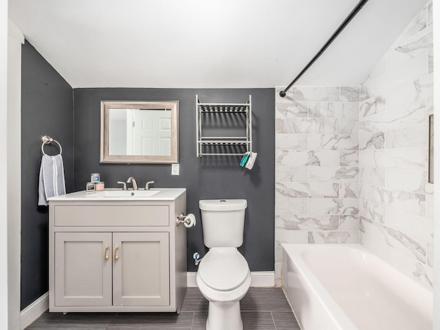 533 Stewart Ave, Columbus, OH 43206 - full bath featuring vaulted ceiling, toilet, vanity, baseboards, and tub / shower combination