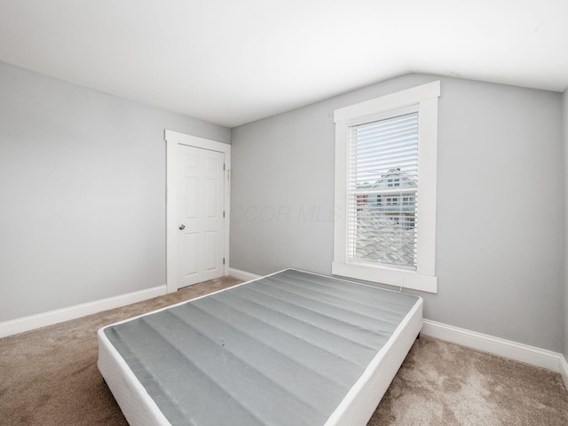 533 Stewart Ave, Columbus, OH 43206 - unfurnished bedroom featuring carpet floors, baseboards, and lofted ceiling