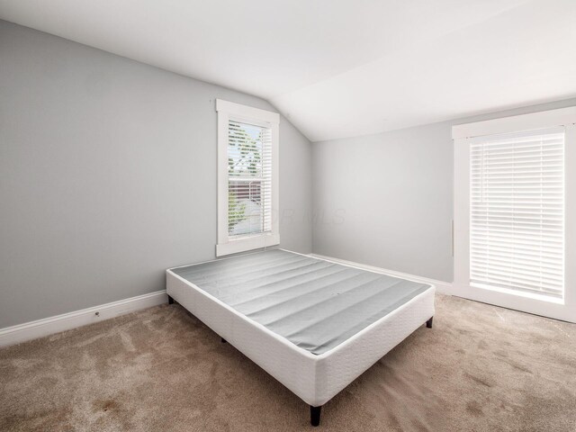 533 Stewart Ave, Columbus, OH 43206 - carpeted bedroom with lofted ceiling and baseboards