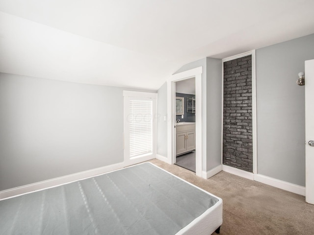 533 Stewart Ave, Columbus, OH 43206 - unfurnished bedroom with carpet flooring, vaulted ceiling, and baseboards