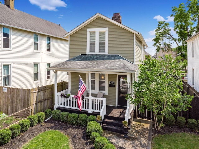 533 Stewart Ave, Columbus, OH 43206 - view of front facade featuring a porch, a chimney, and roof with shingles