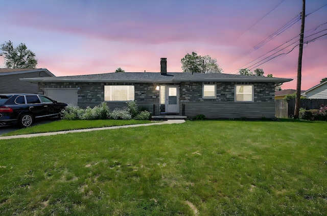 1067 Bronwyn Ave, Columbus, OH 43204 - single story home with an attached garage, a chimney, and stone siding