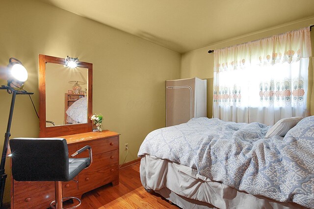 1067 Bronwyn Ave, Columbus, OH 43204 - bedroom featuring wood finished floors and lofted ceiling
