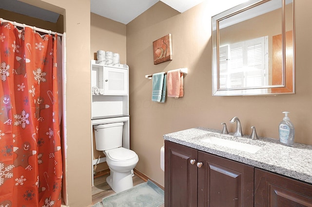 1067 Bronwyn Ave, Columbus, OH 43204 - full bath featuring vanity, toilet, wood finished floors, and a shower with shower curtain