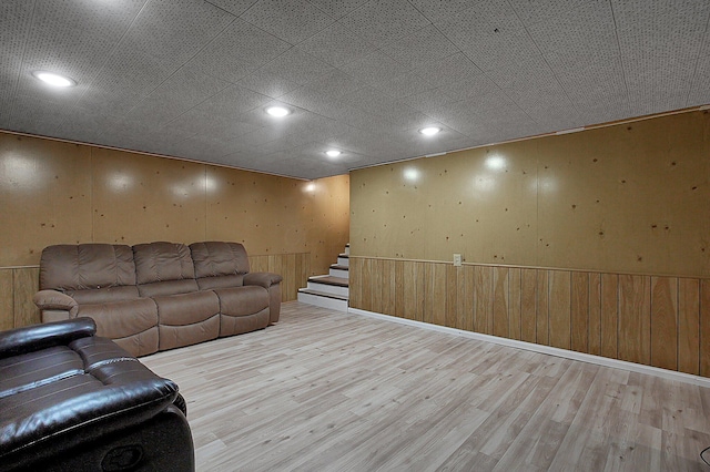 1067 Bronwyn Ave, Columbus, OH 43204 - living area with light wood-style floors, stairway, wooden walls, and recessed lighting
