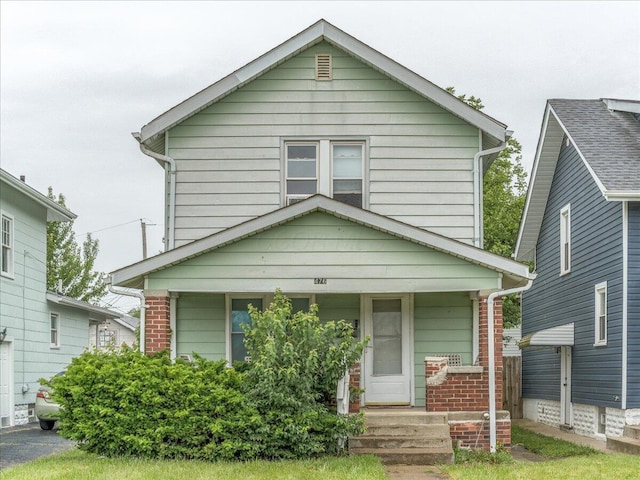476 Graham St, Columbus, OH 43203 - view of front of property featuring a porch and brick siding