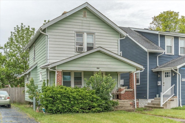 476 Graham St, Columbus, OH 43203 - view of front facade with a porch, a shingled roof, and entry steps