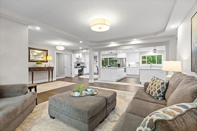 7276 Lee Rd, Westerville, OH 43081 - living area featuring dark wood-style floors, recessed lighting, and baseboards