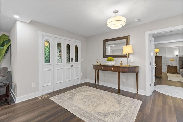 7276 Lee Rd, Westerville, OH 43081 - entrance foyer featuring baseboards and dark wood-style flooring