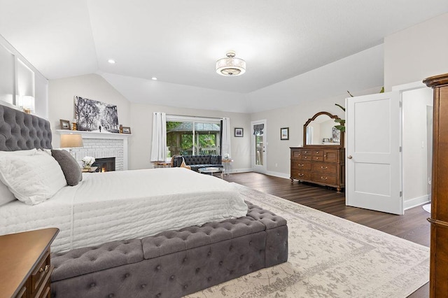 7276 Lee Rd, Westerville, OH 43081 - bedroom with lofted ceiling, dark wood-style flooring, a fireplace, baseboards, and recessed lighting