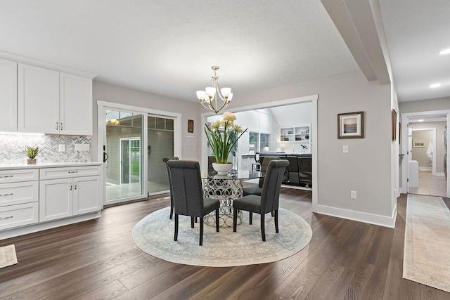 7276 Lee Rd, Westerville, OH 43081 - dining space featuring dark wood finished floors, a chandelier, baseboards, and recessed lighting