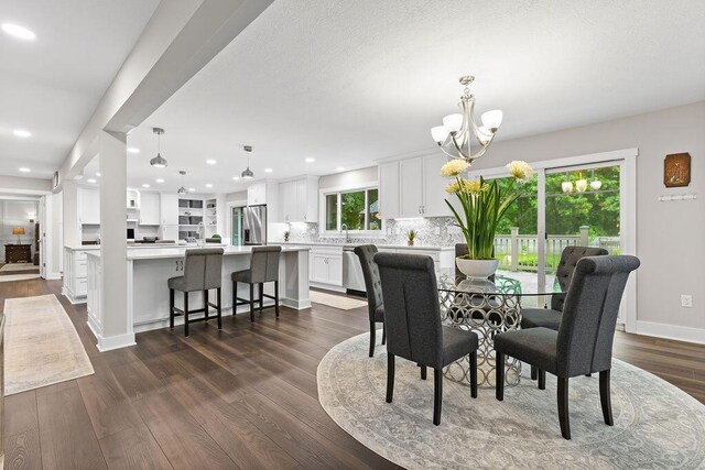 7276 Lee Rd, Westerville, OH 43081 - dining space with a chandelier, dark wood finished floors, recessed lighting, and baseboards