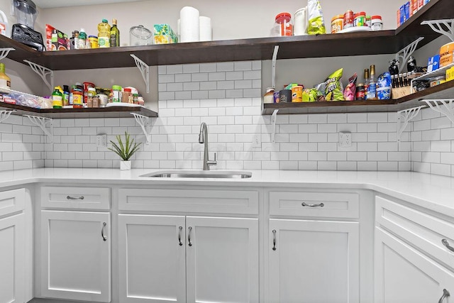 7276 Lee Rd, Westerville, OH 43081 - kitchen featuring open shelves, a sink, and backsplash