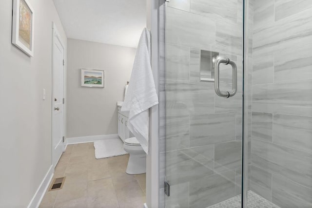 7276 Lee Rd, Westerville, OH 43081 - bathroom featuring a shower stall, toilet, baseboards, and tile patterned floors