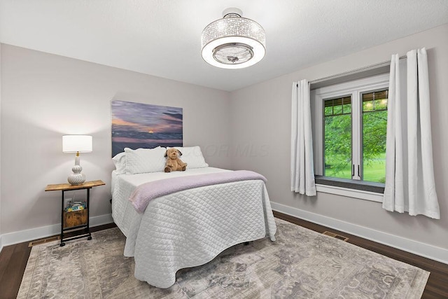 7276 Lee Rd, Westerville, OH 43081 - bedroom featuring baseboards and wood finished floors