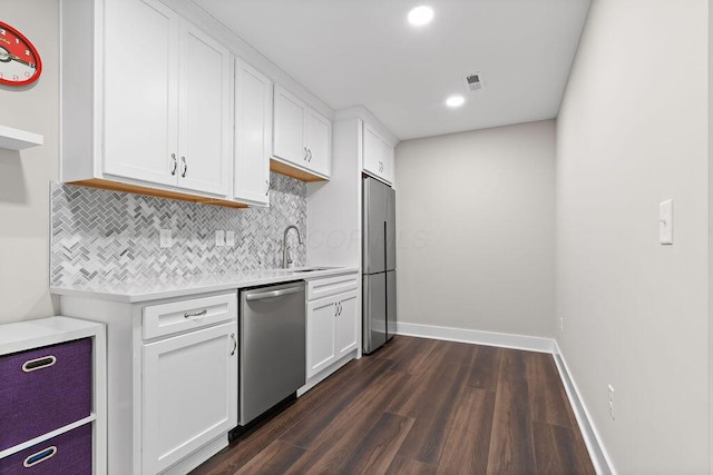 7276 Lee Rd, Westerville, OH 43081 - kitchen with stainless steel appliances, light countertops, decorative backsplash, white cabinets, and recessed lighting