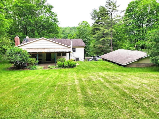 192 Bridle Path Ln, Granville, OH 43023 - back of house with a yard and central air condition unit