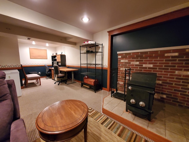 192 Bridle Path Ln, Granville, OH 43023 - living area featuring a wood stove, tile patterned floors, a desk, and baseboards