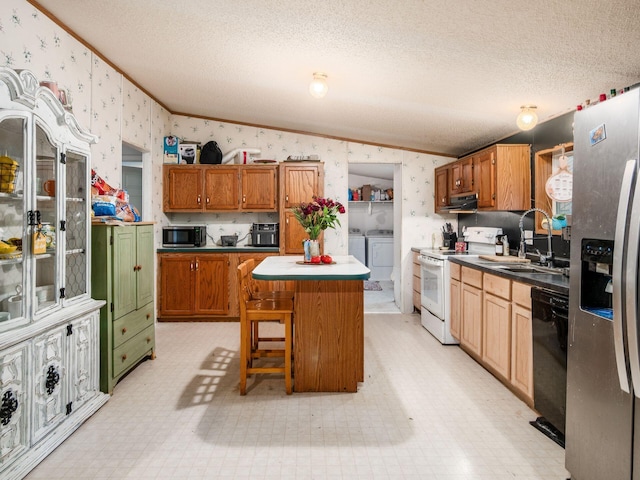 4015 County Road 25, Cardington, OH 43315 - kitchen featuring white range with electric stovetop, wallpapered walls, crown molding, independent washer and dryer, and stainless steel fridge