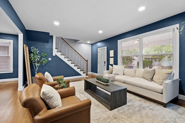731 Siebert St, Columbus, OH 43206 - living room featuring stairway, baseboards, wood finished floors, and recessed lighting