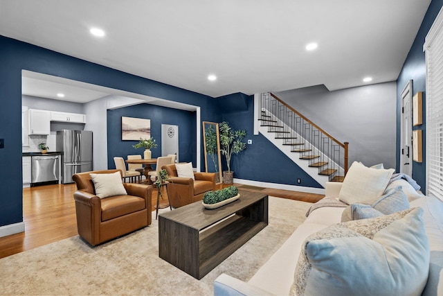 731 Siebert St, Columbus, OH 43206 - living room with stairway, light wood finished floors, recessed lighting, and baseboards