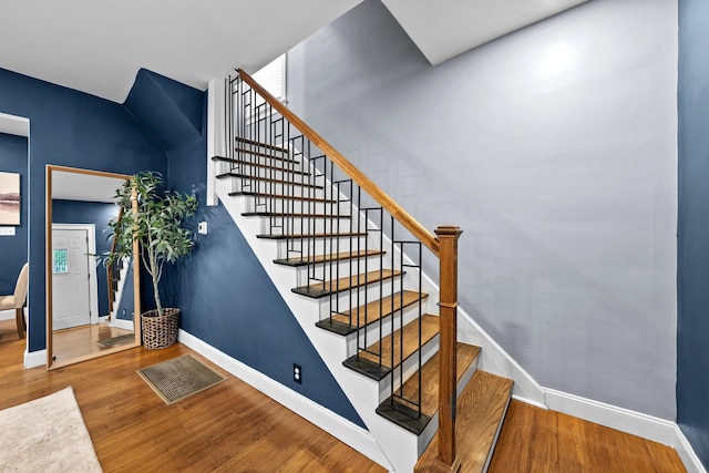 731 Siebert St, Columbus, OH 43206 - stairway featuring wood finished floors and baseboards