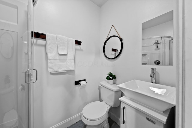 731 Siebert St, Columbus, OH 43206 - bathroom featuring toilet, a shower stall, baseboards, and vanity