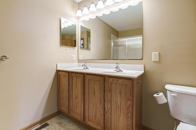 2378 Myrtle Valley Dr, Columbus, OH 43228 - bathroom with double vanity, toilet, an enclosed shower, and baseboards